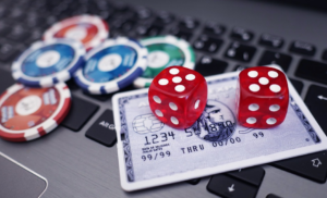 credit card and dice on laptop